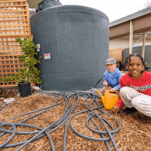 Students at La Tercera Elementary School Filling a Watering Can with Rainwater to Use on the Landscape - Morgan Margulies