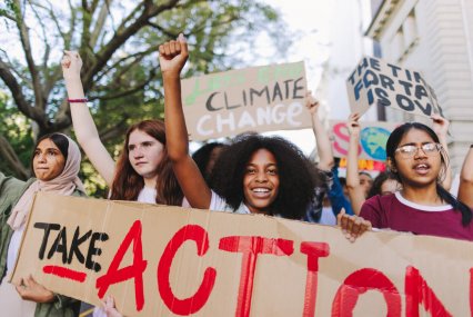 Happy youth activists marching against global warming