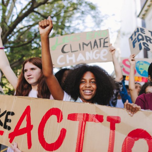 Happy youth activists marching against global warming